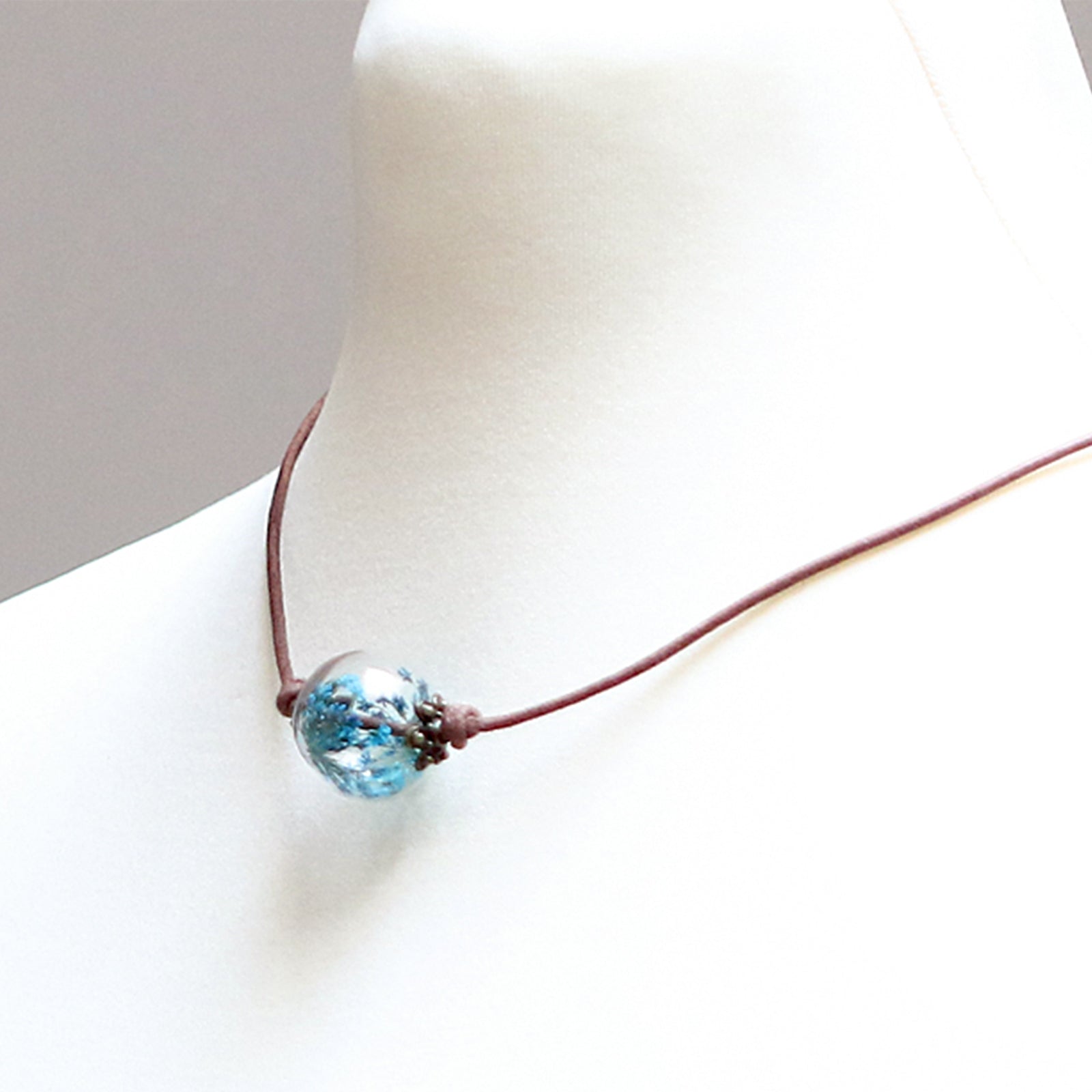 Leather necklace made of real turquoise dill flowers