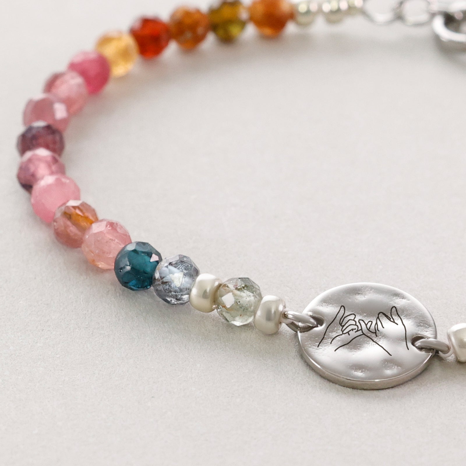 Rainbow tourmaline bracelet with hammered plate