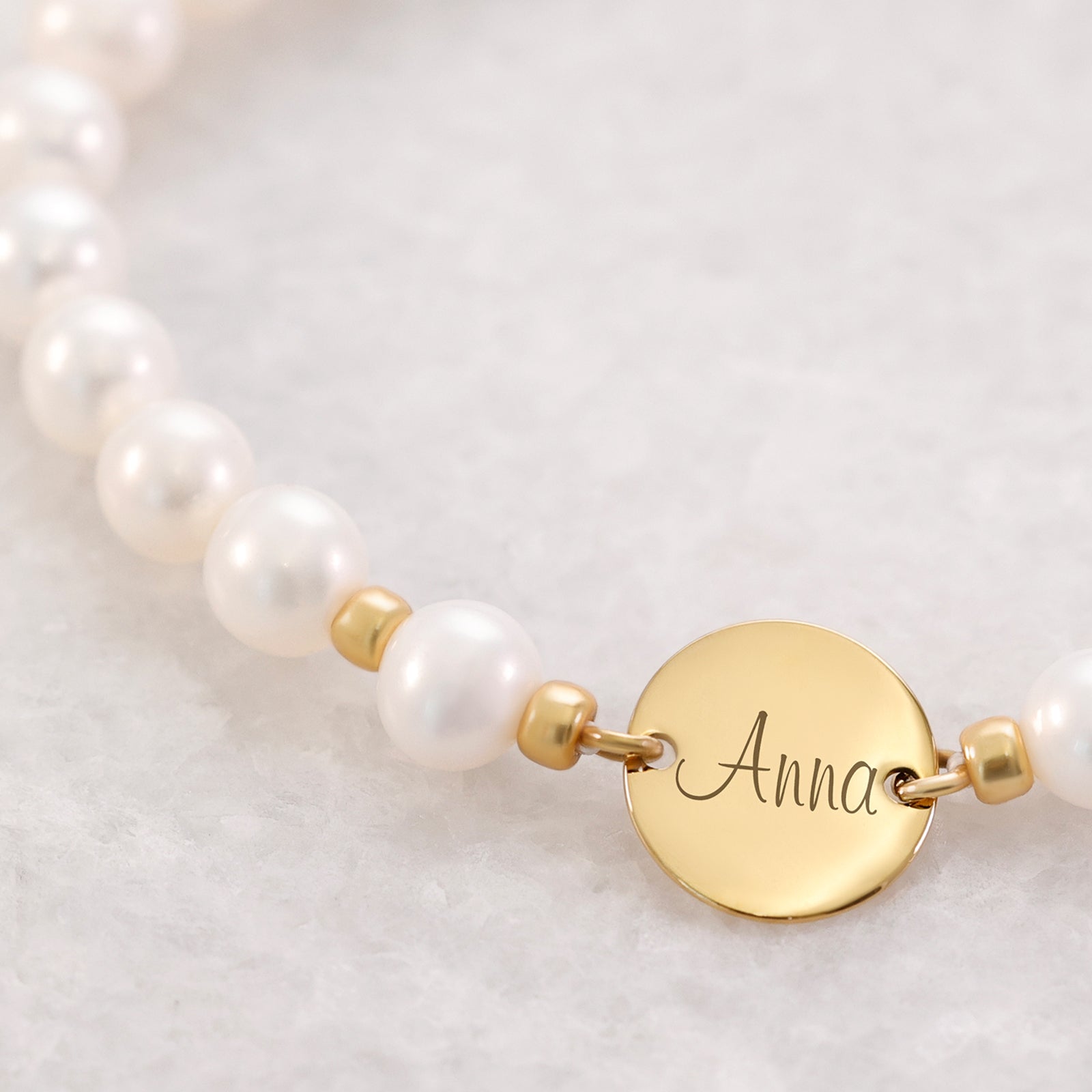 Süßwasserperlen Armband mit runden Plättchen