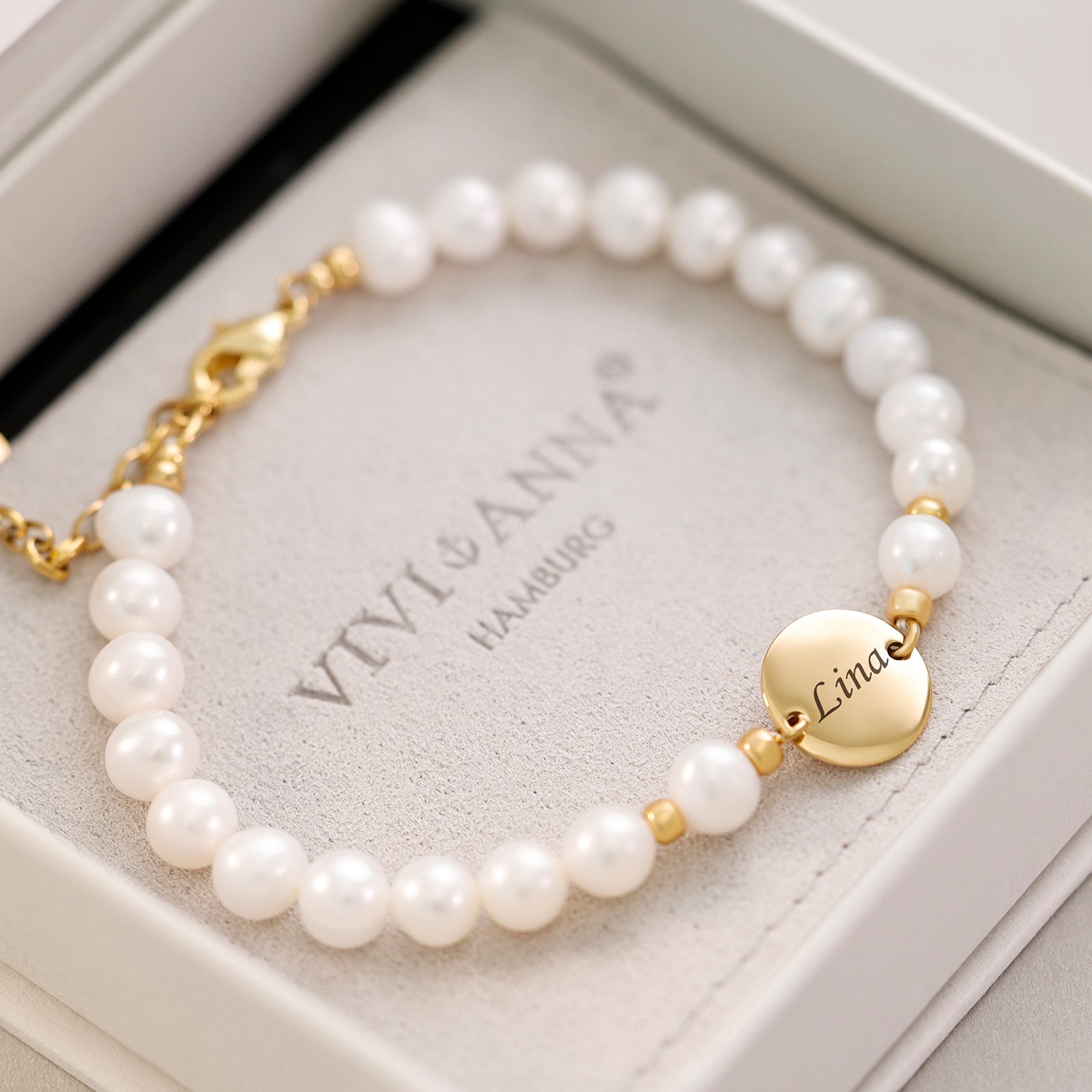 Süßwasserperlen Armband mit runden Plättchen