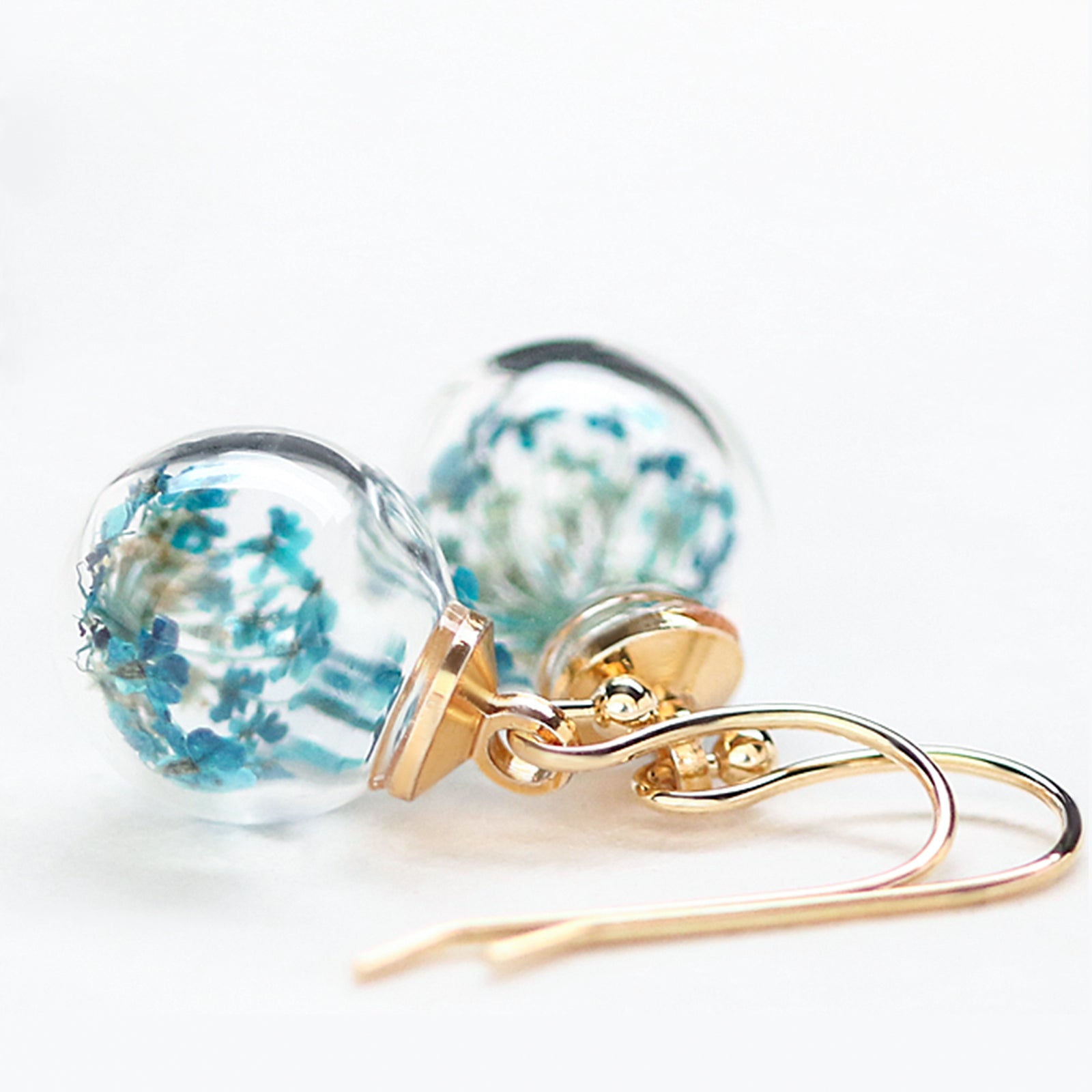 Earrings with real turquoise dill flowers