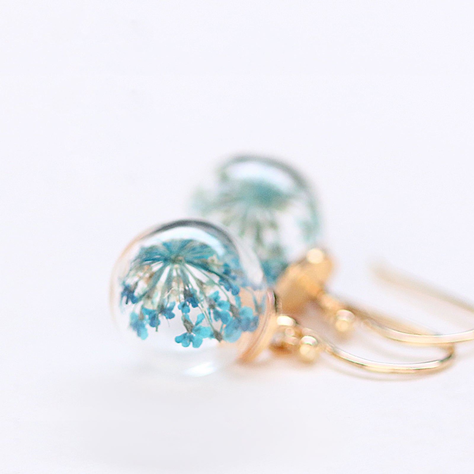Earrings with real turquoise dill flowers
