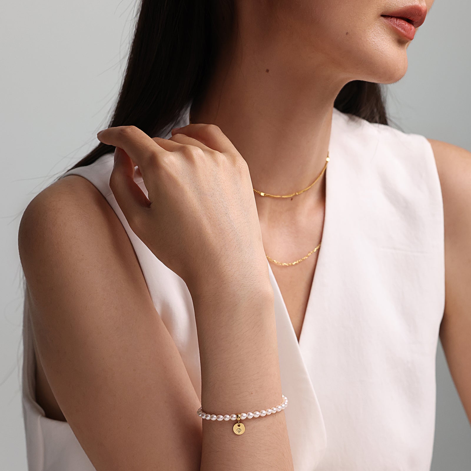 Perlenarmband aus Süßwasserperlen mit rundem Plättchen