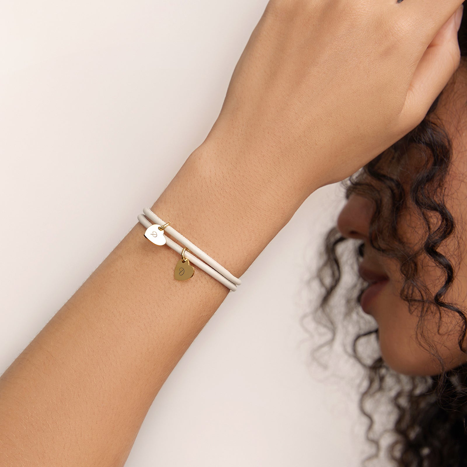 Adjustable leather bracelet with heart pendant
