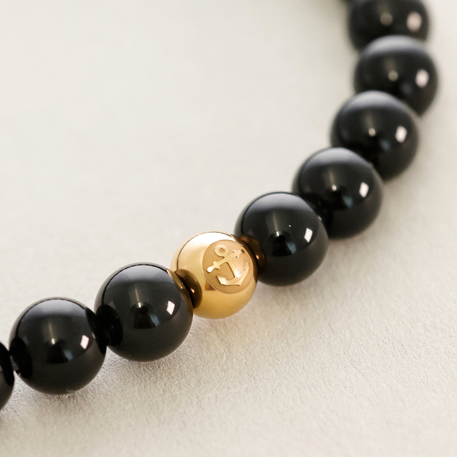 Maskulines Stretch-Armband aus Obsidian mit Anker-Detail